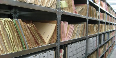 Shelving full of files and documents - Collaborative Research